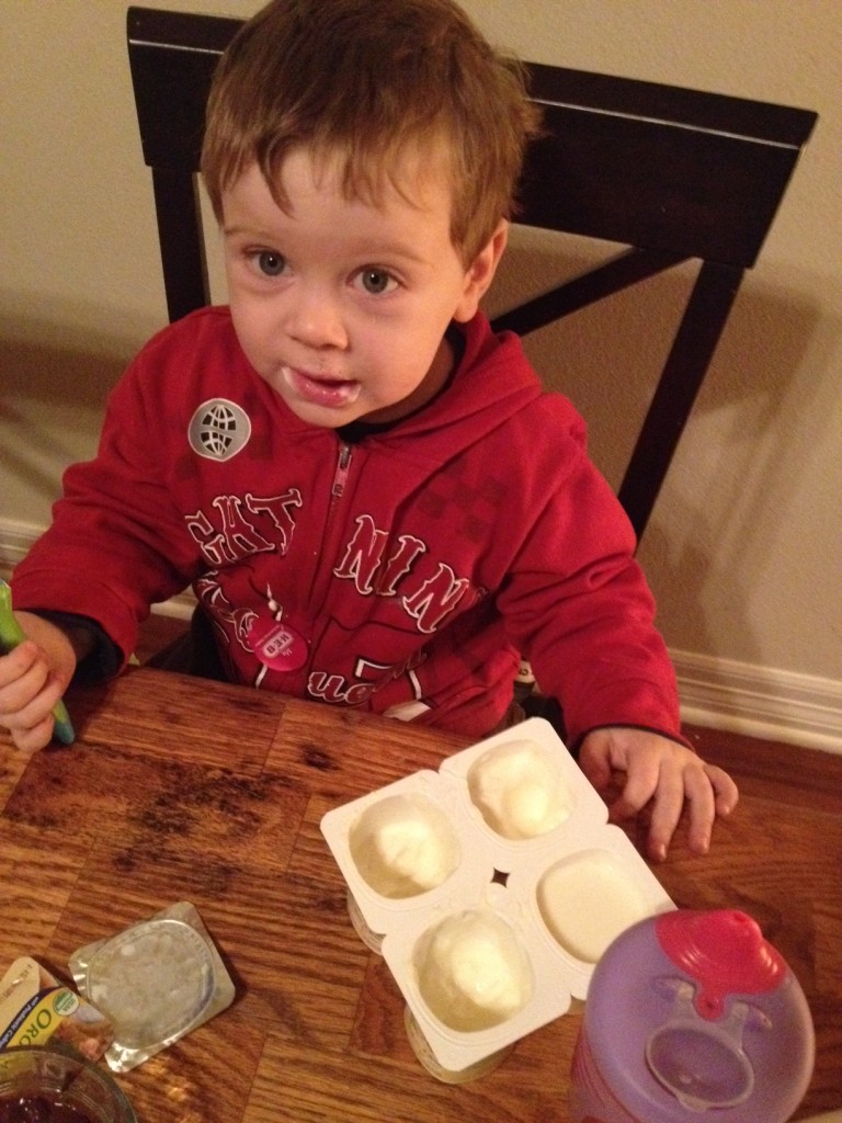 Helping himself to an entire pack of yogurt.
